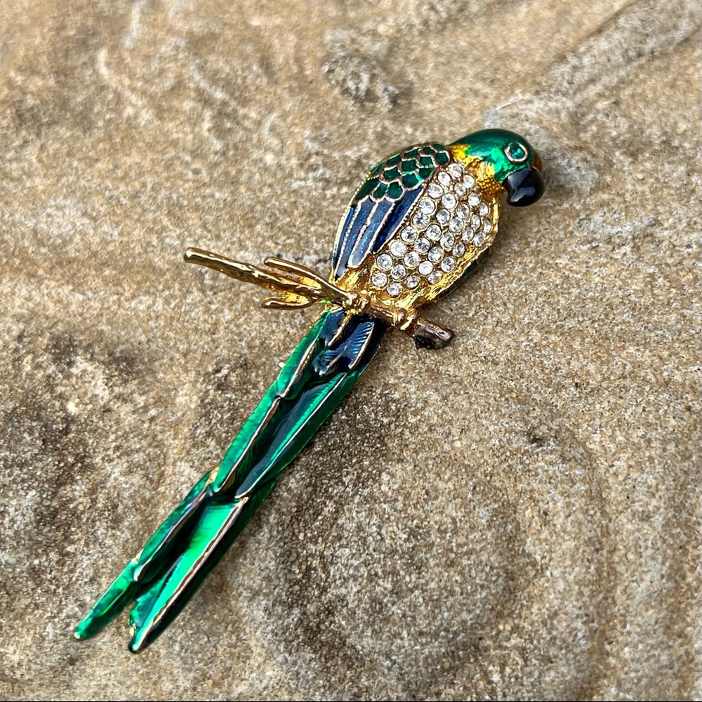 & Vibrant blue and green parrot brooch encrusted with rhinestones